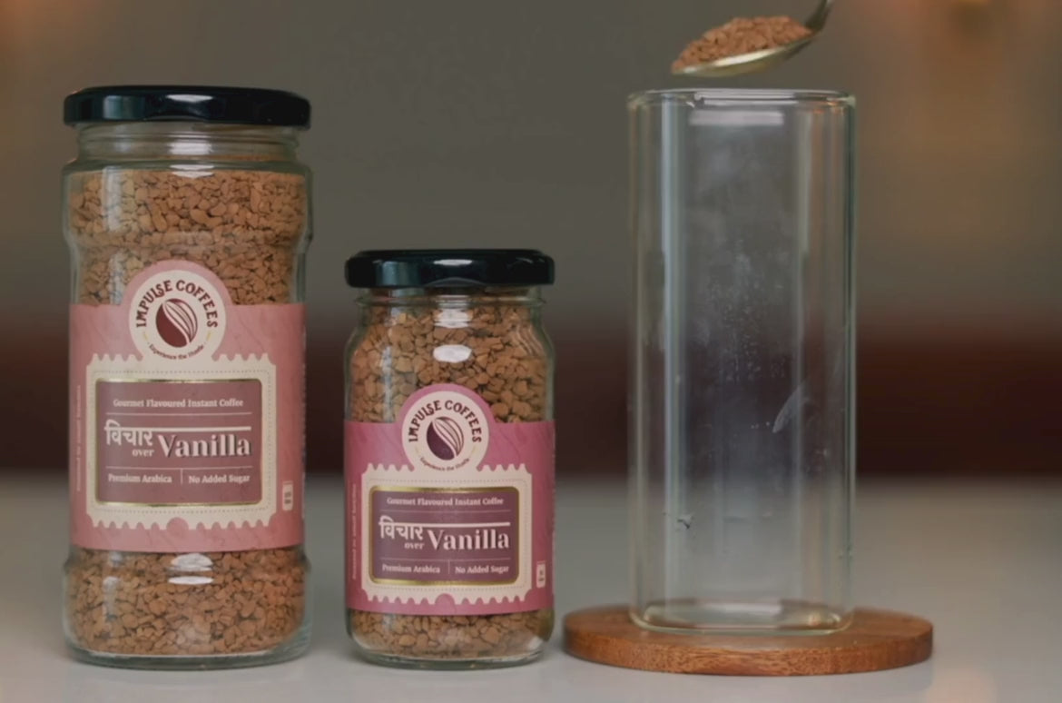 A video of "how to make Vichaar Over Vanilla Coffee" which has a 50gms and a 100gms jar and a glass to make the coffee