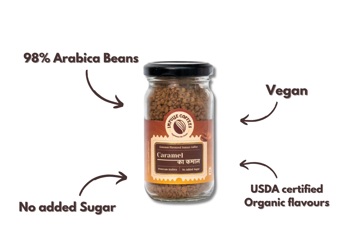 A Jar of Caramel Ka Kamal coffee with labels indicating 98% Arabica Beans, Vegan, No added Sugar, and USDA certified Organic flavors on a white background.